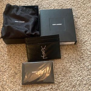 Brand new in box with tags YSL card case.